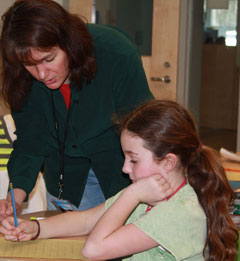 Melissa Stewart conferring with a studen